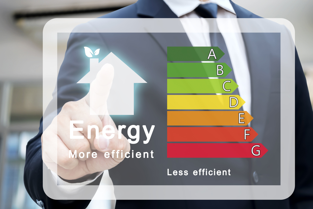 Energy efficiency rating of buildings for sustainable development.Businessman pointing to energy efficiency rating chart